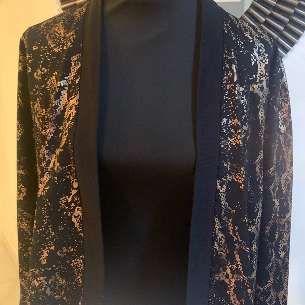 This is a beautiful black and gold Peter Nygard   Jacket